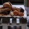 Different kind of bread at white napkin on wooden pallet