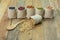 Different kinds of beans in sacks bag on wooden background