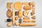 Different kinds of fresh bread on light background