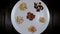 Different kinds of nuts in white dish top view Almonds, Pistachios, Cashews, peanut, hazelnut, Dry Fruits.