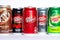Different kinds of a popular Dr. Pepper carbonated soda cans (Classic, Cherry and Zero) and others on white background