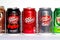 Different kinds of a popular Dr. Pepper carbonated soda cans (Classic, Cherry and Zero) on white background.