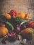 different kinds of tomato, vegetables, onion, pepper, garlic still life,rustic