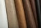 Different leather samples as background, closeup