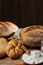 Different loaves of bread cooked with flour and gluten-free wheat on a wooden table