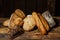 Different loaves of bread cooked with flour and gluten-free wheat on a wooden table