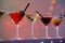 Different martini cocktails against blurred background