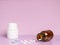 Different medications. Various pill bottles. One-color backdrop.