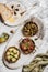 Different Mediterranean vegetarian meze, olive oil and fresh bread