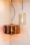 Different modern streamlined mirror copper chandeliers. Cylindrical metal copper shade pendant