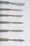 Different One-Piece Scalpels on white background