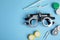 Different ophthalmologist tools on blue background, flat lay. Space for text