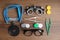 Different ophthalmologist tools on wood, flat lay
