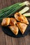 Different oriental baked pie with meat samsa