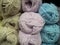 Different pastel color woolen threads for knitting. Colored balls of yarn