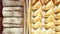 Different pies and bread on wooden trays in shop upper view