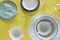Different porcelain tableware on yellow background