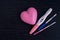 Different positive pregnancy tests with a pink heart