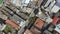 Different roofs of houses. View of the houses of red clay roofs and eternity.