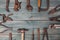 Different rusty construction instruments on the green wooden background