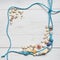 Different seashells and rope on white wooden background. Frame made of turquoise marine rope. Copy space