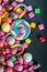 Different sets on a black background, candy, chewing gum, candy