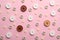 Different sewing buttons on pink background