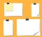 Different sheets of note papers and paper clips on orange background