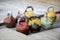 Different sizes of kettlebells weights lying on gym floor. Equip