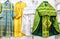 Different solemn colorful orthodox priest`s robes