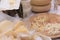 Different sorts of Italian cheese wheels at a market