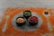 Different spices, silhouettes of cutlery and plate on grey table, closeup