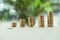 Different stacks of coins standing on table