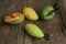 Different styles of mangoes on the wooden board