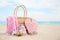 Different stylish beach objects and coral on sand. Space for text