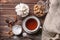 Different sugar with cup of tea on wooden table