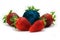 Different than the rest alone blue strawberry.Concept for genetically modified food