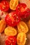 Different tomatoes on a wooden background