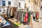 Different traditional bavarian clothes for sale on an outdoor flea market