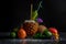 Different tropical fruits. Pineapple cup, ripe avocado, garnet and coconut on a black background. Summer ingredients.