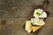 Different types of cheese on a wooden cutting board. Dairy products. Milk processing. Diet food.