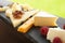 Different types of delicious cheeses and snacks on slate plate