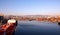 Different types of dry cargo, passenger and container vessels in motion and moored at the port of Izmir, Turkey.