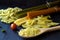 Different types of Italian pasta with a wooden spoon on a table with copy space