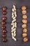 Different types of nuts: walnut, peanut, chestnut on wooden