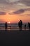 Different types of silouette people at the beach during a beautiful sunset in France montalivet