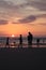 Different types of silouette people at the beach during a beautiful sunset in France montalivet