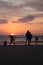 Different types of silouette people at the beach during a beautiful sunset in France montalivet