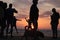 Different types of silouette people at the beach during a beautiful sunset in France montalivet