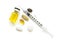 Different types of tablets, empty syringe needle, yellow liquid in ampoule, arranged abstract on white. Health, treatment, choice